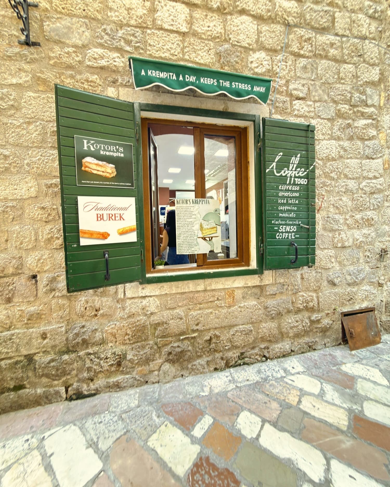 A bakery window in Kotor, advertising burek and krempita