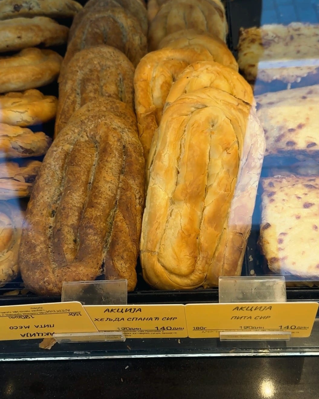 Burek and pastries stacked in the window at Hleb&Kifle Sremska in Belgrade