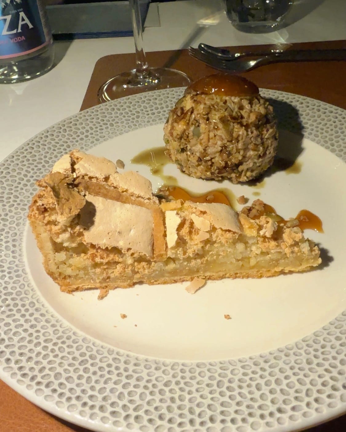 A slice of Peraška torta, the Perast almond cake, with a scoop of ice cream