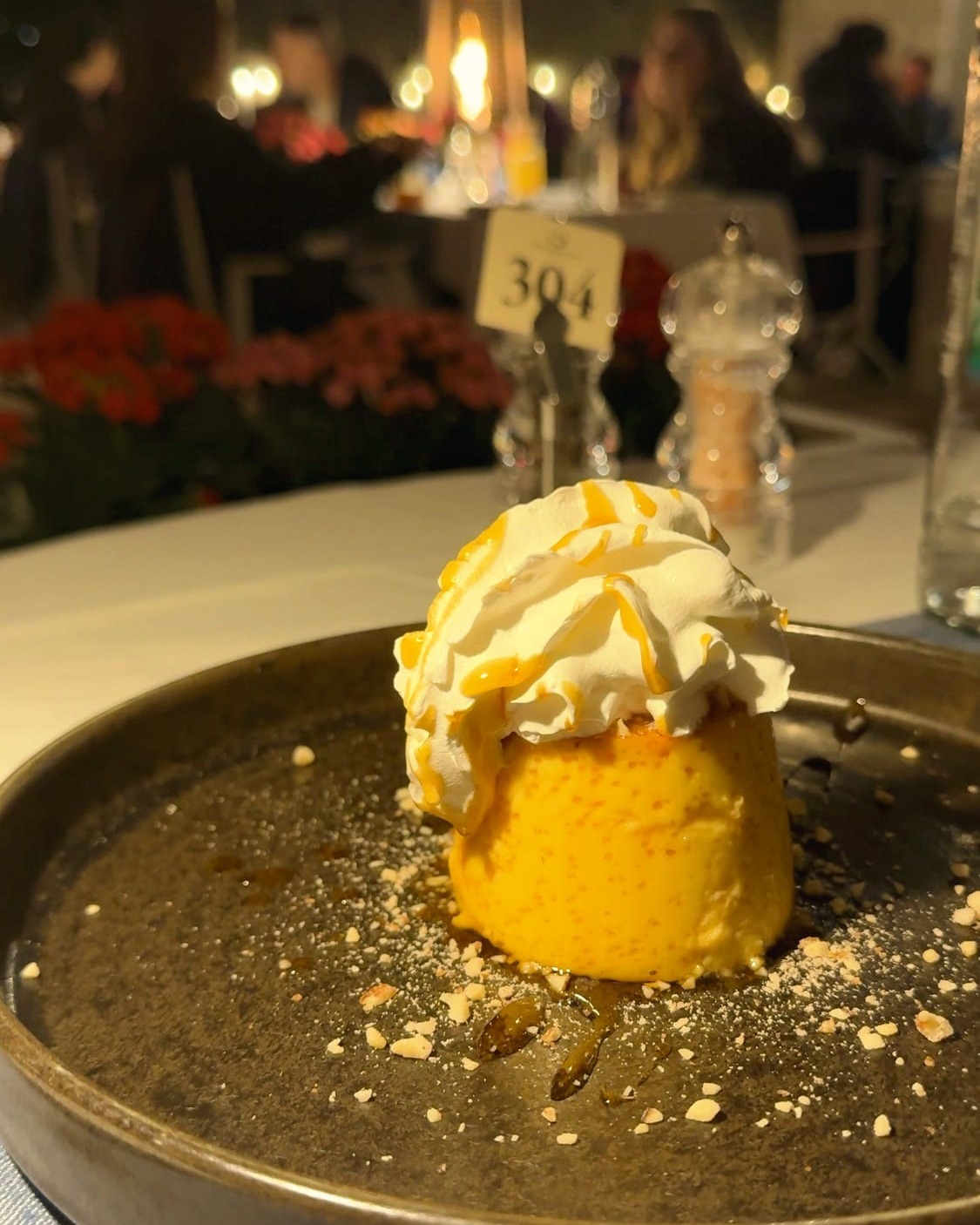 Rozata, Dubrovnik's caramel custard, turned out on a dark plate