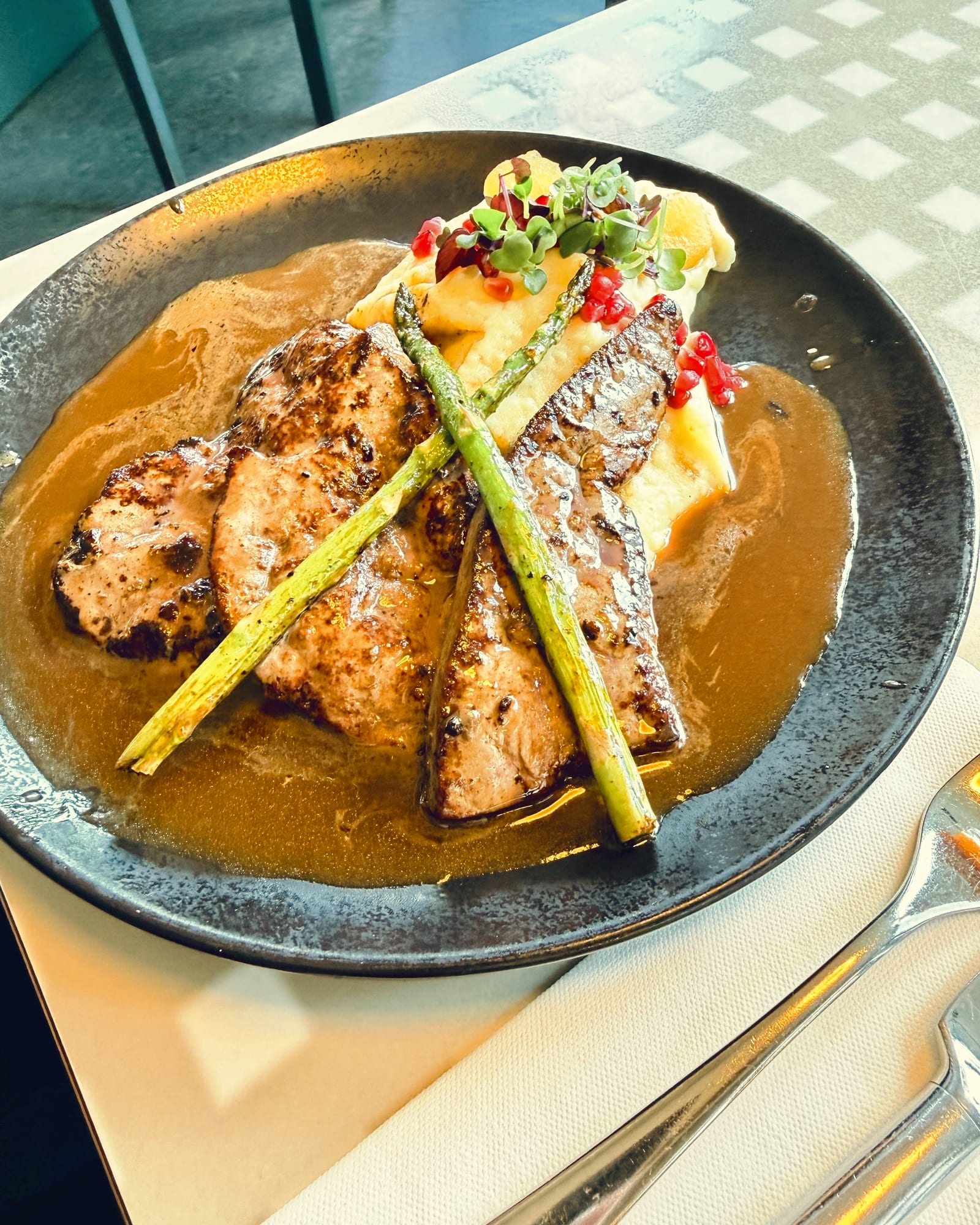 Glazed calf liver at Lugeck, in a glossy reduction with asparagus